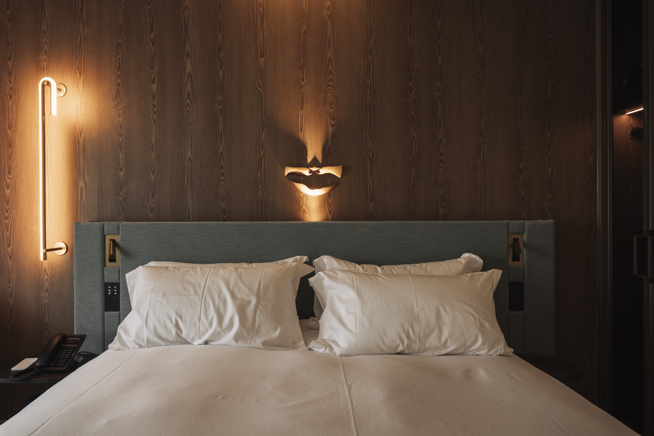 The plush hotel beds evoke dreamlike clouds straight from a surrealist painting.