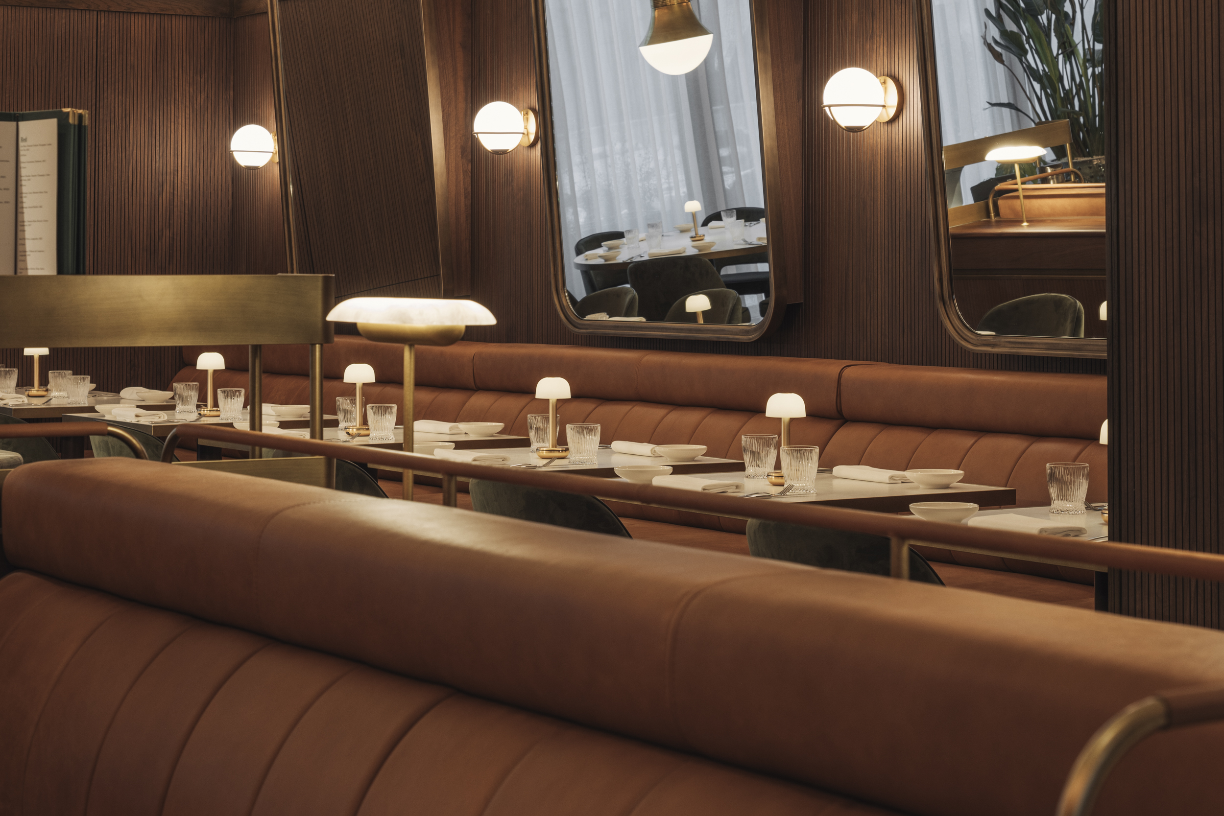 The leather enrobed banquettes at Let Petit Bon Bon.