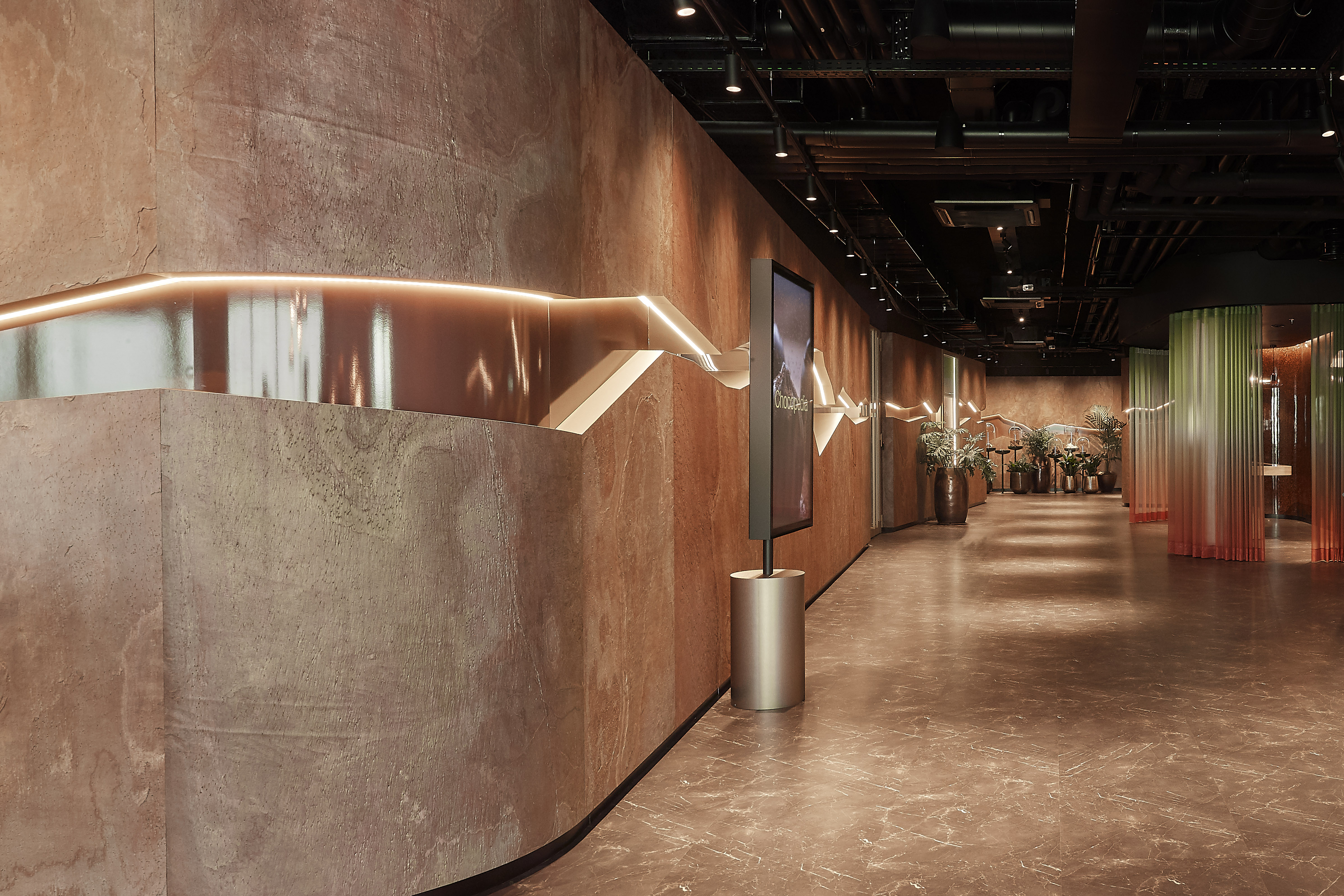 The prominent cracked wall acts as the main focal point of the Chocolate Experience.